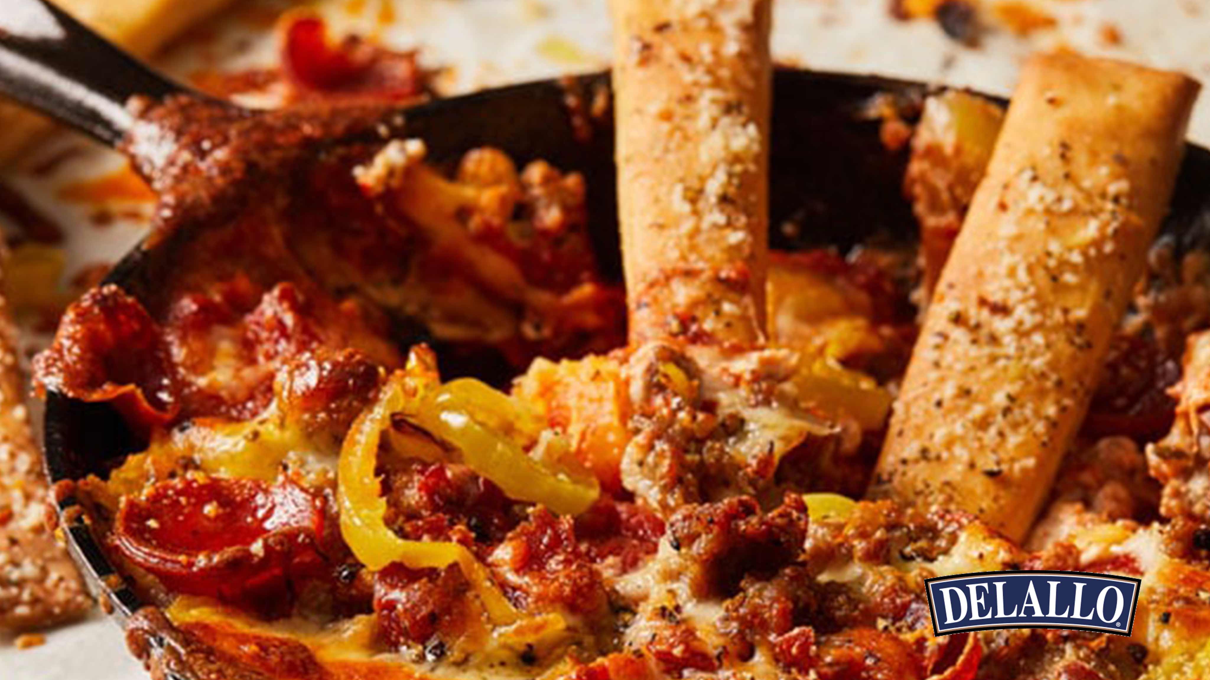 Image for Recipe Layered Pizza Dip and Garlicky Breadsticks